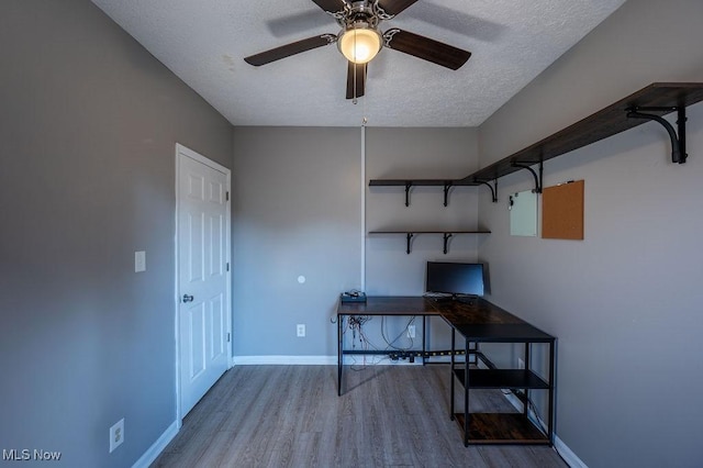 4412 14th Ave, Parkersburg, WV 26101 - unfurnished office featuring wood finished floors, a textured ceiling, and a ceiling fan