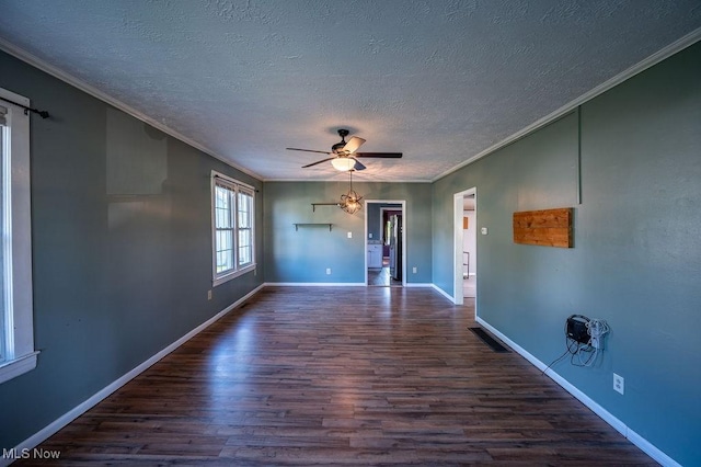 4412 14th Ave, Parkersburg, WV 26101 - empty room featuring dark wood-style flooring, ornamental molding, a textured ceiling, and ceiling fan