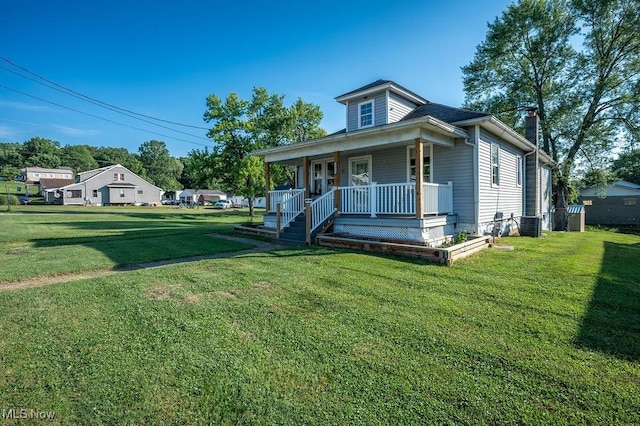 4412 14th Ave, Parkersburg, WV 26101 - bungalow-style home with covered porch, a chimney, and a front yard
