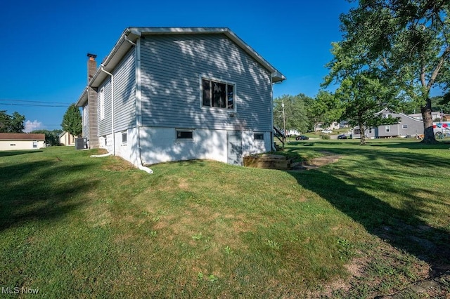 4412 14th Ave, Parkersburg, WV 26101 - view of home's exterior with a lawn and a chimney