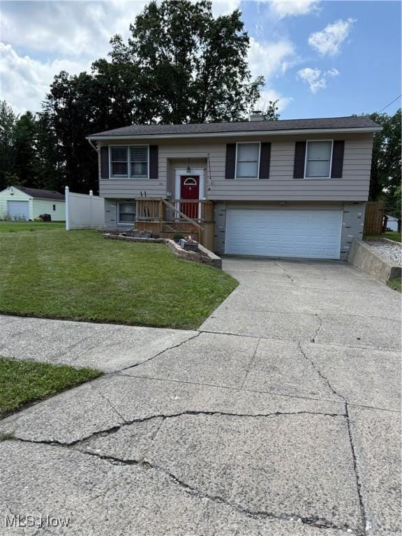 130 Kleber Ave, Austintown, OH 44515 - bi-level home with an attached garage and driveway