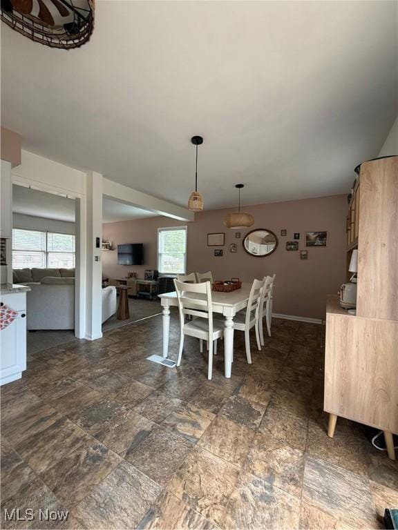 130 Kleber Ave, Austintown, OH 44515 - dining room featuring dark stone finish floors and baseboards