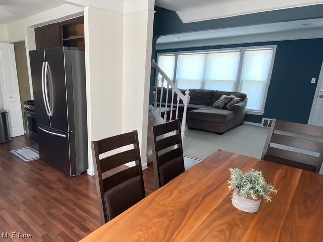 5384 Huron Rd, Lyndhurst, OH 44124 - dining room featuring dark wood-type flooring and stairway