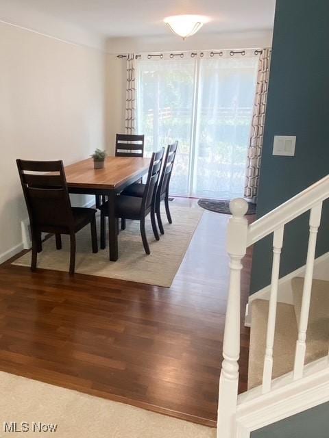 5384 Huron Rd, Lyndhurst, OH 44124 - dining space with wood finished floors and stairway