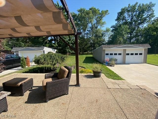5384 Huron Rd, Lyndhurst, OH 44124 - view of patio with an outbuilding and a garage