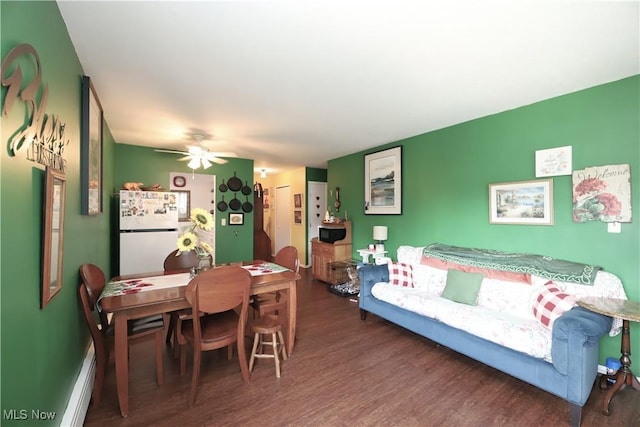 20312 Lorain Rd Unit 314, Fairview Park, OH 44126 - dining room with wood finished floors, a baseboard heating unit, and ceiling fan