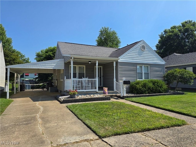 119 E 6th St, Williamstown, WV 26187 - view of front of property with a porch, a carport, a front yard, driveway, and roof with shingles