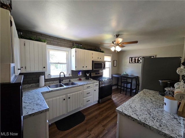 119 E 6th St, Williamstown, WV 26187 - kitchen featuring stainless steel appliances, healthy amount of natural light, ceiling fan, and light countertops