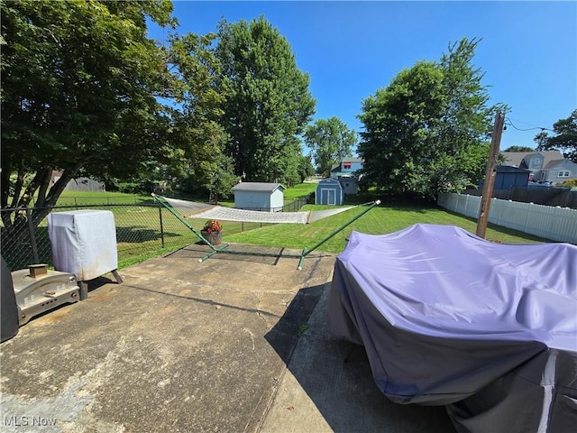 119 E 6th St, Williamstown, WV 26187 - fenced backyard with a shed and a patio