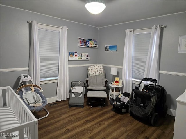 119 E 6th St, Williamstown, WV 26187 - bedroom with wood finished floors and a crib