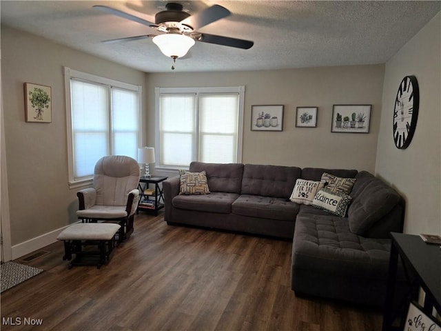 119 E 6th St, Williamstown, WV 26187 - living room featuring a ceiling fan, dark wood-style floors, and a textured ceiling