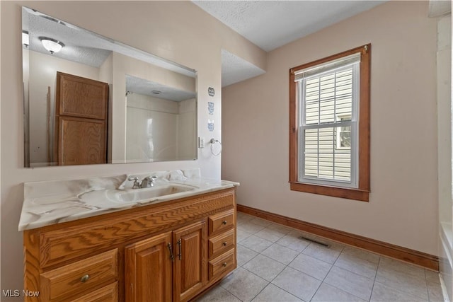 4010 11th Ave, Parkersburg, WV 26101 - bathroom with vanity, tile patterned flooring, and a textured ceiling