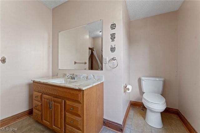 4010 11th Ave, Parkersburg, WV 26101 - bathroom featuring vanity, a textured ceiling, and tile patterned floors