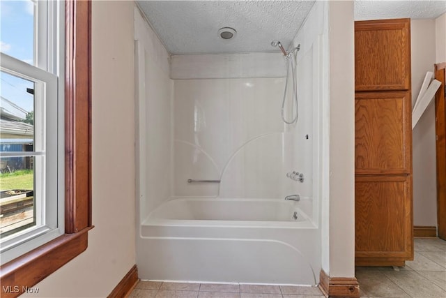 4010 11th Ave, Parkersburg, WV 26101 - full bathroom with bathtub / shower combination, a textured ceiling, and tile patterned flooring