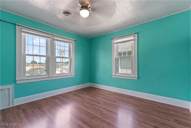 4010 11th Ave, Parkersburg, WV 26101 - unfurnished room featuring healthy amount of natural light, wood finished floors, and a ceiling fan