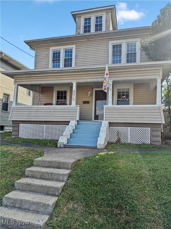 4010 11th Ave, Parkersburg, WV 26101 - american foursquare style home featuring covered porch and a front lawn