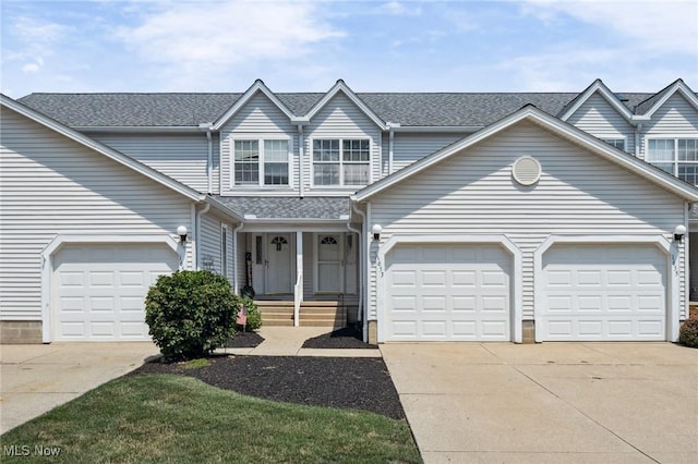 1653 Maple View Ct, Streetsboro, OH 44241 - traditional-style house featuring a garage, driveway, covered porch, and roof with shingles