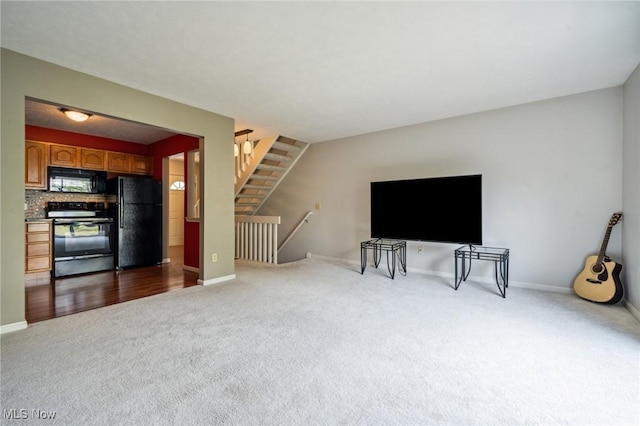 1653 Maple View Ct, Streetsboro, OH 44241 - unfurnished living room with carpet floors and baseboards
