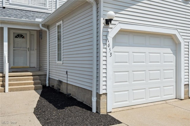 1653 Maple View Ct, Streetsboro, OH 44241 - doorway to property featuring a garage, roof with shingles, and driveway