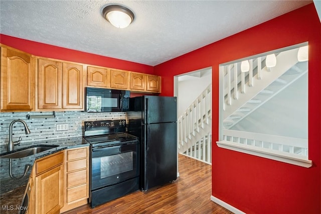 1653 Maple View Ct, Streetsboro, OH 44241 - kitchen featuring black appliances, tasteful backsplash, dark wood-style floors, dark stone counters, and a textured ceiling