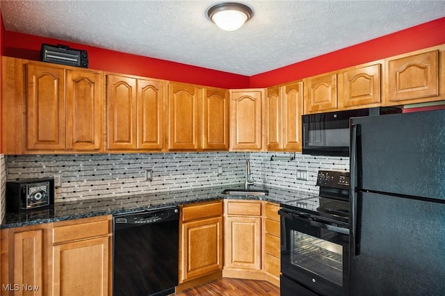 1653 Maple View Ct, Streetsboro, OH 44241 - kitchen featuring black appliances, wood finished floors, a textured ceiling, decorative backsplash, and brown cabinetry