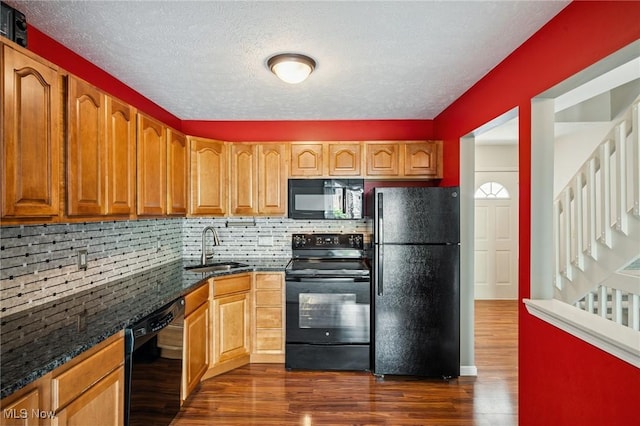 1653 Maple View Ct, Streetsboro, OH 44241 - kitchen featuring black appliances, dark wood-style floors, backsplash, dark stone countertops, and a textured ceiling