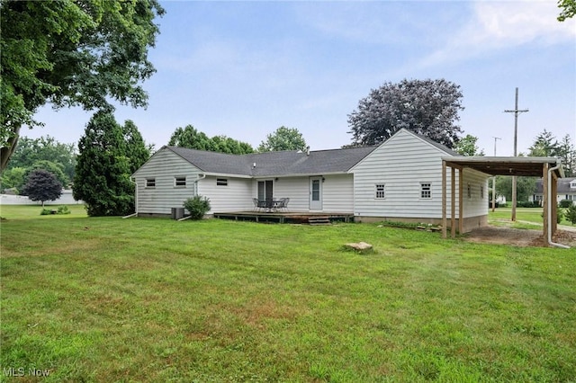 34 Prospect St, Seville, OH 44273 - rear view of property featuring a wooden deck, a yard, and an attached carport