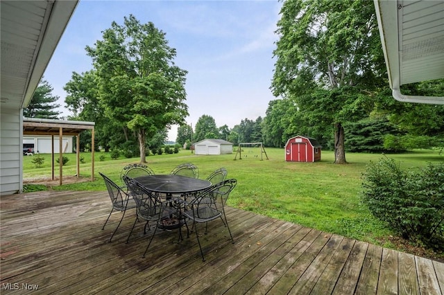 34 Prospect St, Seville, OH 44273 - deck featuring a storage unit, outdoor dining area, and a lawn