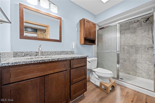 34 Prospect St, Seville, OH 44273 - bathroom with a shower stall, wood finished floors, and vanity