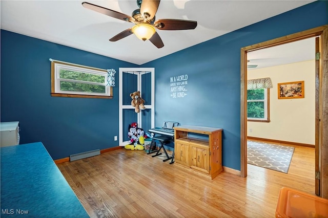 34 Prospect St, Seville, OH 44273 - office space with a ceiling fan, wood finished floors, and a baseboard radiator