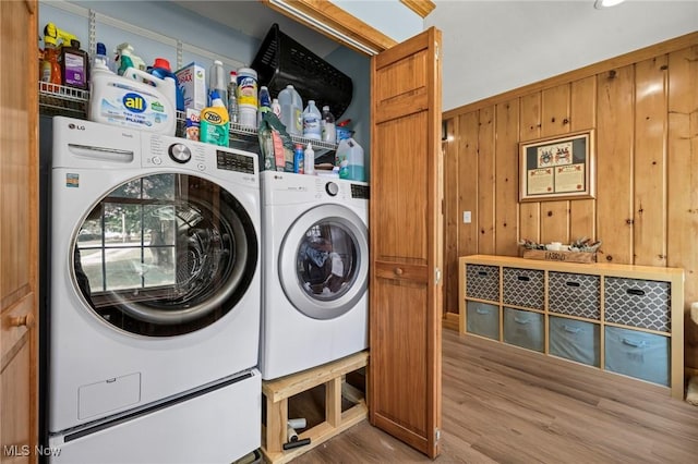 34 Prospect St, Seville, OH 44273 - laundry area with wood finished floors, independent washer and dryer, and wooden walls