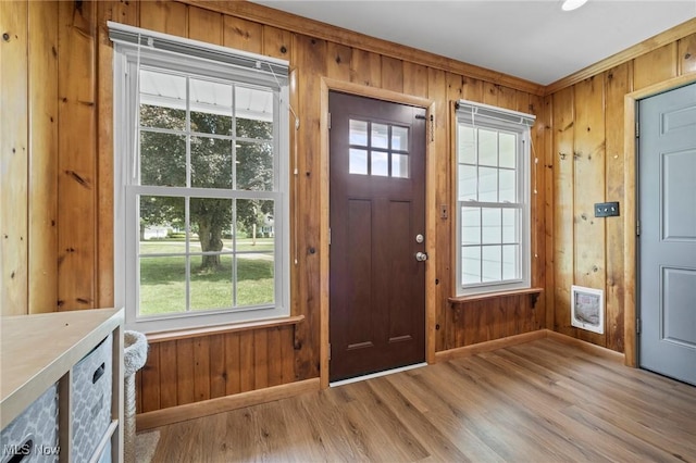 34 Prospect St, Seville, OH 44273 - foyer with wood walls, light wood finished floors, and healthy amount of natural light