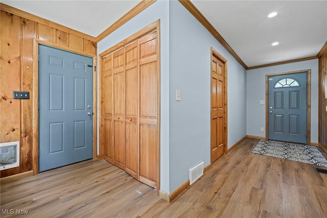 34 Prospect St, Seville, OH 44273 - entryway with ornamental molding, light wood-type flooring, heating unit, and recessed lighting