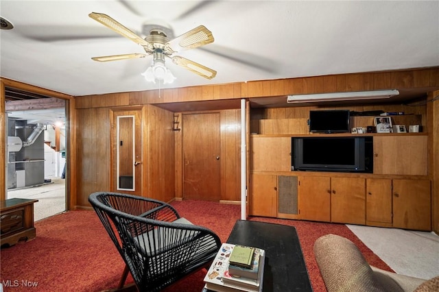 34 Prospect St, Seville, OH 44273 - living area featuring carpet floors, ceiling fan, wood walls, and heating unit