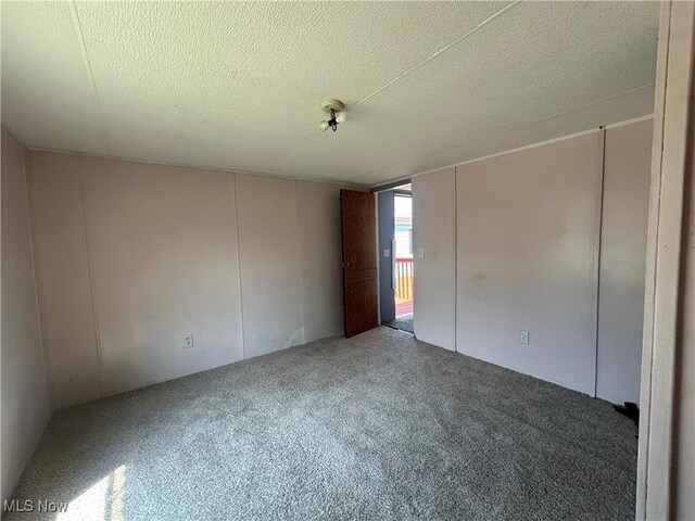 152 N Main St Unit 2, New London, OH 44851 - carpeted empty room featuring a textured ceiling