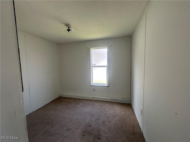 152 N Main St Unit 2, New London, OH 44851 - carpeted empty room featuring a textured ceiling