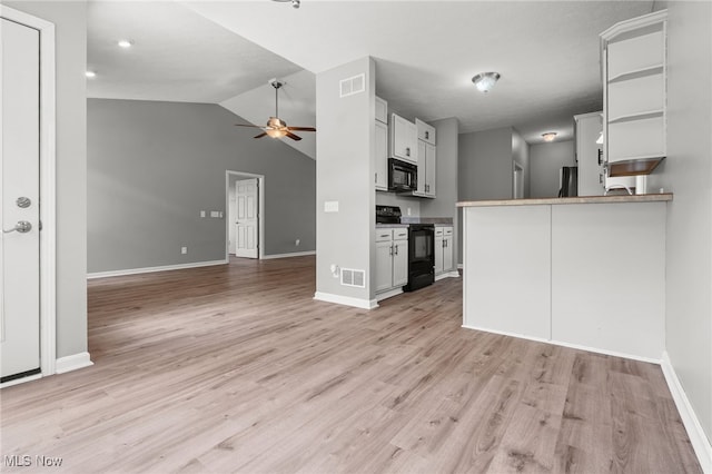4428 Trail Head Cir NW, Massillon, OH 44647 - kitchen featuring black appliances, ceiling fan, open floor plan, light wood-style floors, and lofted ceiling