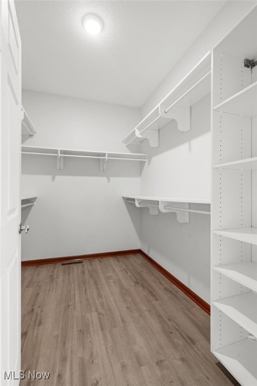 4428 Trail Head Cir NW, Massillon, OH 44647 - spacious closet with wood finished floors