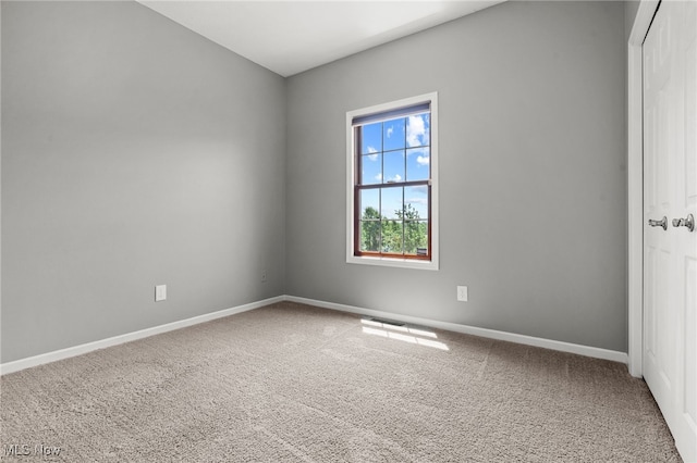 4428 Trail Head Cir NW, Massillon, OH 44647 - empty room featuring carpet flooring and baseboards