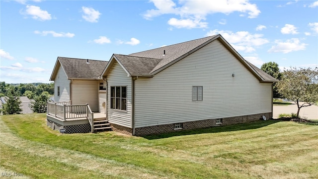 4428 Trail Head Cir NW, Massillon, OH 44647 - back of house with roof with shingles, a yard, a wooden deck, and crawl space