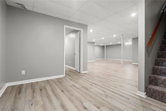 4428 Trail Head Cir NW, Massillon, OH 44647 - finished basement featuring stairs, a paneled ceiling, light wood finished floors, and recessed lighting