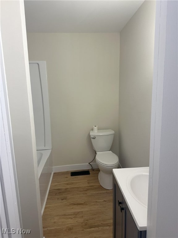 9822 Hooper Rd, Athens, OH 45701 - bathroom with vanity, wood finished floors, and a bath