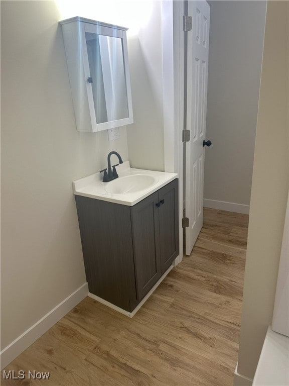 9822 Hooper Rd, Athens, OH 45701 - bathroom featuring vanity and wood finished floors