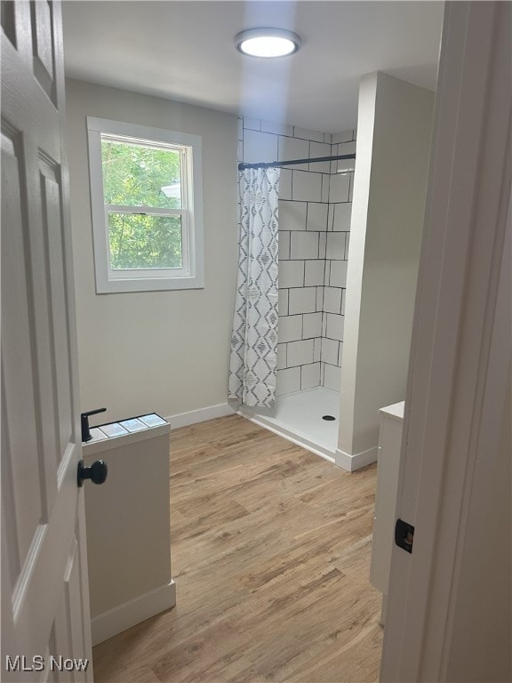 9822 Hooper Rd, Athens, OH 45701 - full bathroom featuring a tile shower, wood finished floors, and vanity