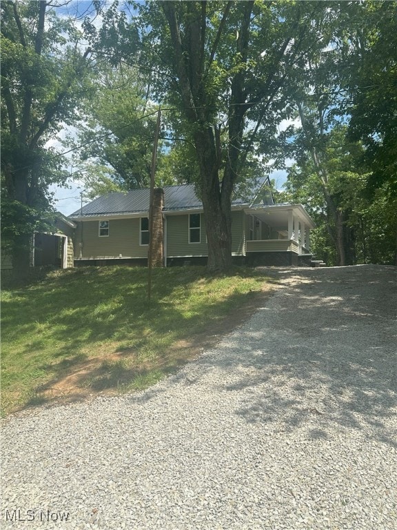 9822 Hooper Rd, Athens, OH 45701 - view of front of property featuring gravel driveway, a metal roof, and a carport