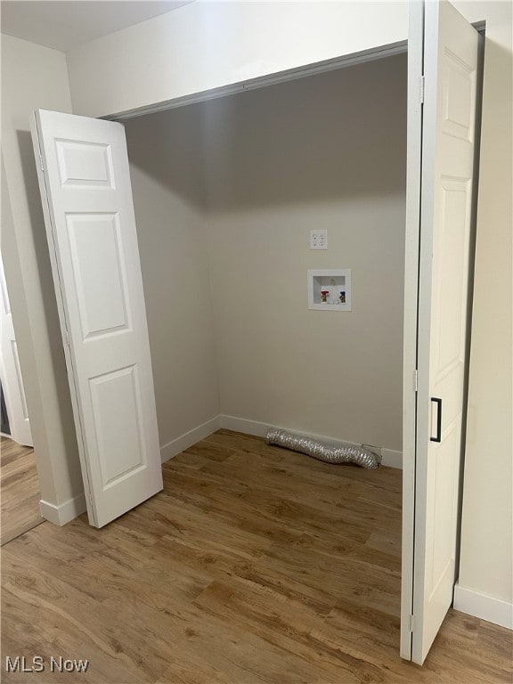 9822 Hooper Rd, Athens, OH 45701 - laundry room featuring hookup for a washing machine and wood finished floors