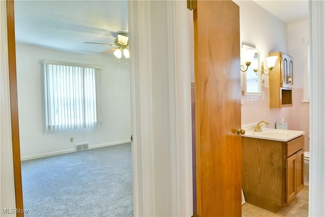 131 Euclid Blvd, Youngstown, OH 44505 - bathroom with vanity, ceiling fan, and healthy amount of natural light