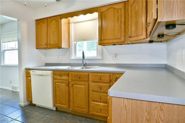 131 Euclid Blvd, Youngstown, OH 44505 - kitchen featuring dishwasher, plenty of natural light, and brown cabinetry