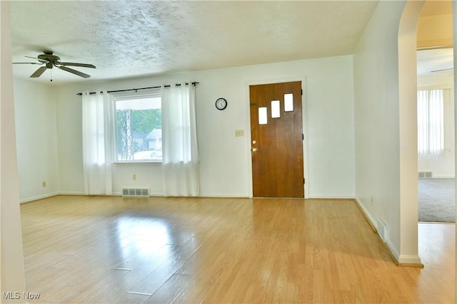 131 Euclid Blvd, Youngstown, OH 44505 - entryway with arched walkways, healthy amount of natural light, a ceiling fan, light wood-style floors, and a textured ceiling