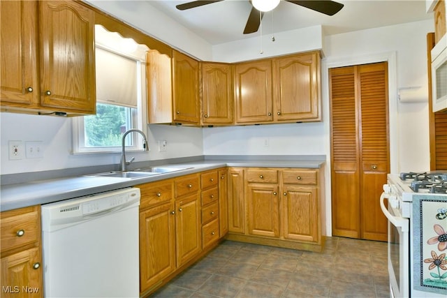 131 Euclid Blvd, Youngstown, OH 44505 - kitchen featuring white appliances, a ceiling fan, brown cabinets, and light countertops